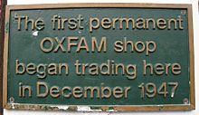 Plaque attached to the original Oxfam shop at 17 Broad Street, Oxford First Oxfam shop plaque crop.jpg