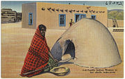 Puebloan woman at her adobe bake-oven