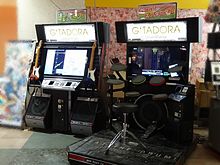 Gitadora XG2 GuitarFreaks (left) and DrumMania (right) cabinets GITADORA XG Standard.JPG