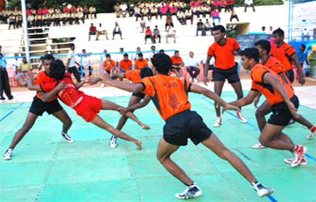 A team tackle occurring in the ancient Indian game of kabaddi.