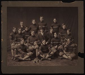 Heisman at center of 1909 Georgia Tech football team picture, wearing a hat and glasses