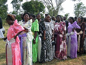 Women wearing Gomesi at a wedding in Kampala, Uganda. Gomesi.jpg