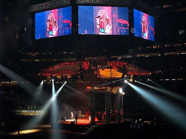 Cyrus performing "Pumpin' Up the Party" as Hannah Montana on the final concert of the Best of Both Worlds Tour on March 9, 2008.