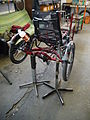 Hase Kettwiesel recumbent tricycle being maintained.JPG