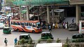 Labbaik Paribahan bus under Karwan Bazar metro station in Dhaka.jpg