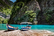 The Komani Lake is a popular ferry ride in southern Europe. It is similar to the Scandinavian fjord with its mountains. Lake Koman Albania 2016.jpg