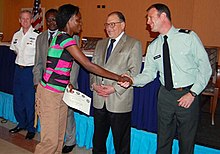 U.S. Army Africa Lt. Col. Stephen Salerno congratulates a student upon completion of military legal education in N'Djaema, Chad, September 2010. Legal education in Chad 2010 (5080920938).jpg