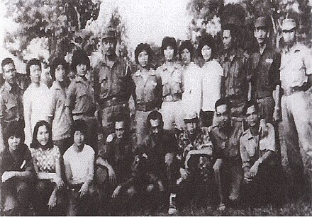 Members of the Sarawak People's Guerilla Force (SPGF), North Kalimantan National Army (NKNA) and Indonesian National Armed Forces (TNI) taking photograph together marking the close relations between them during Indonesia under the rule of Sukarno.
