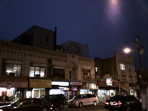 A Midwood shopping street at night