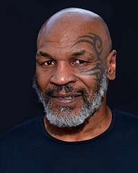 Going into the fight, Mike Tyson held the WBA, WBC, and IBF world heavyweight titles, while Michael Spinks was the Ring and lineal champion Mike Tyson 2019 by Glenn Francis.jpg