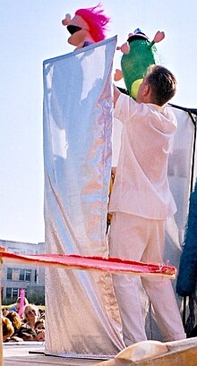 Puppeteer with hand puppets. Nikolai Zykov with hand puppets, Russia.jpg