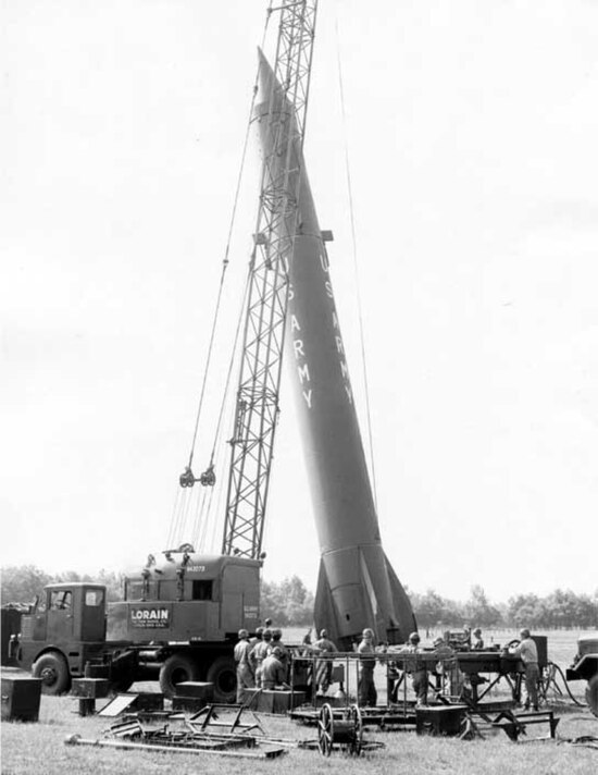 US Army field group erecting Redstone missile