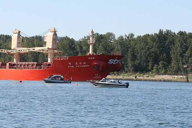 Ocean-going cargo ship anchored at the mouth of the Willamette