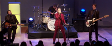 Panic! at the Disco at the Shorty Awards in 2015, where they first performed as a solo project. Panic! At The Disco Shorty Awards 2015.png