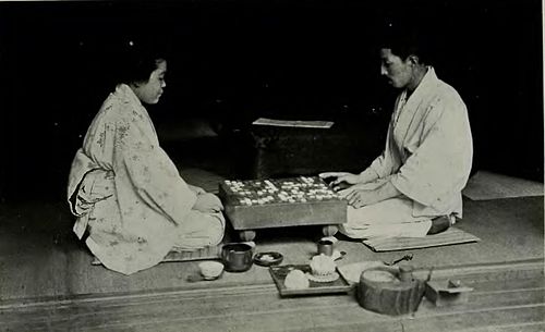 two japanese people playing go.