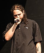 Post Malone made his UK top 10 debut in September of this year with "Rockstar", a collaboration with fellow rapper 21 Savage, which spent four weeks at number-one. Post Malone (28150758223) (cropped).jpg