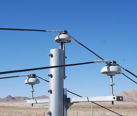 Power lines supported by ceramic pin-type insulators in California, USA
