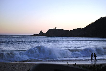 The main beach with Punta Cometa in the background