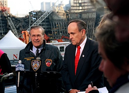 Rumsfeld and New York City Mayor Rudy Giuliani speak at the site of the World Trade Center attacks in Lower Manhattan on November 14, 2001