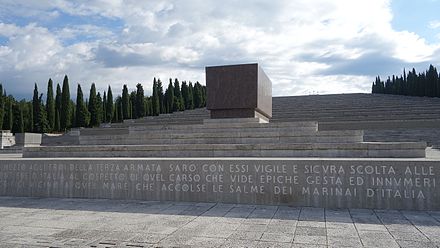 The Redipuglia War Memorial of Redipuglia, with the tomb of Prince Emanuele Filiberto, Duke of Aosta in the foreground, nicknamed the Undefeated Duke for having reported numerous victories in the First World War without ever being defeated on the battlefield.[163] This War Memorial is the resting place of 100,187 Italian soldiers killed between 1915 and 1917 in the eleven battles fought on the Karst and Isonzo front.[164]