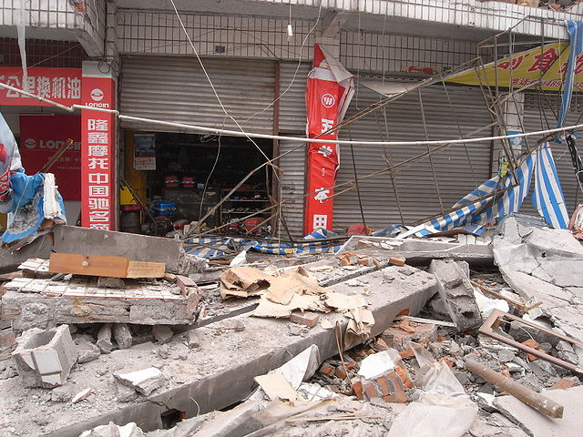 The outside of a warehouse in disarray following the earthquake.