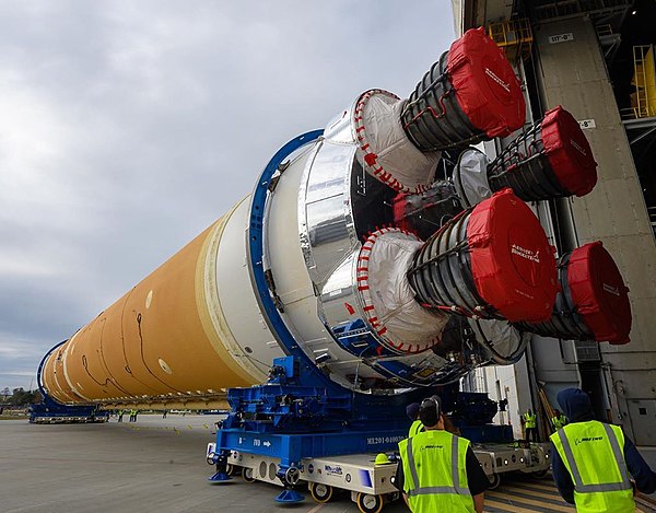 The SLS core stage rolling out of the Michoud Assembly Facility for shipping to Stennis Space Center