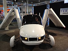 Prototype with wings partially folded Terrafugia -- 2012 NYIAS -- front view, folding wings.jpg