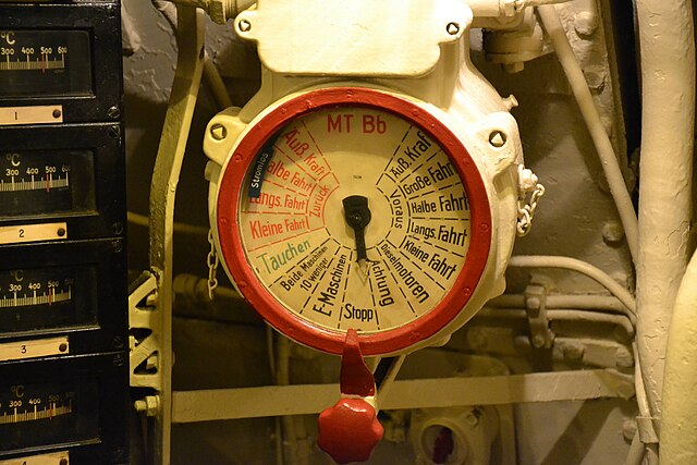 An engine order telegraph dial located in the engine compartment of U-505. "MT" is Maschinen Telegraf, (Telegraph Machine), and "Bb", indicating Backb