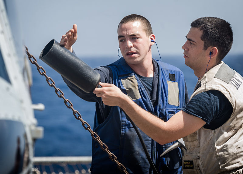 File:U.S. Navy Damage Controlman 3rd Class Michael Vita and Hull Technician Fireman Jeffery Dehoedt simulate extinguishing a fire on an MH-60R Seahawk helicopter during a flight deck firefighting drill aboard 130521-N-HN991-003.jpg