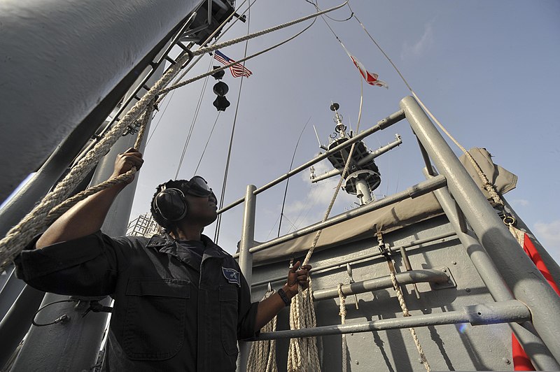 File:U.S. Navy Quartermaster Seaman Kendria Houseworth raises a signal flag for fixed wing operations aboard the amphibious assault ship USS Bataan (LHD 5) in the Arabian Sea April 5, 2014 140405-N-IK431-045.jpg