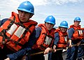 120: US Navy 100517-N-1559J-018 Line handlers aboard USS Laboon (DDG 58) take up slack on the replenishment line during an underway replenishment.jpg