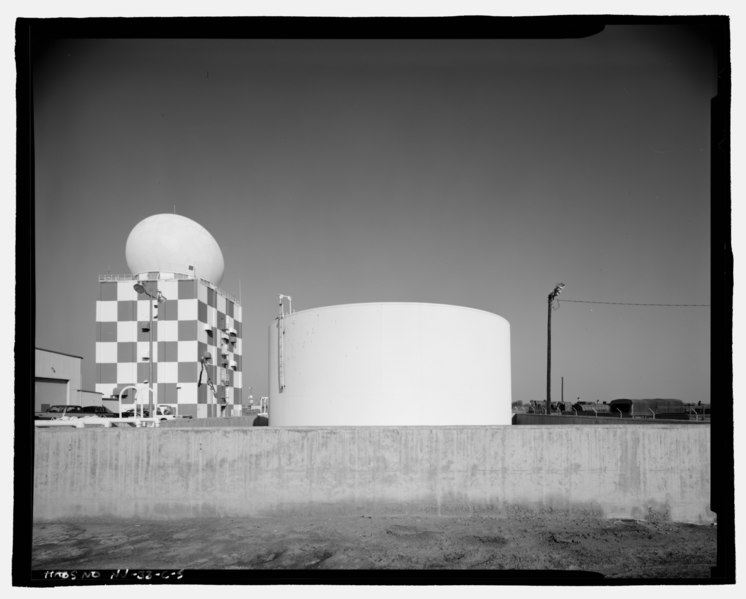 File:View of east elevation of fuel tanks, radar tower and power plant in background, looking west - Naval Air Station Fallon, Fuel Tanks, 800 Complex, off Carson Road near intersection of HABS NV-33-C-5.tif