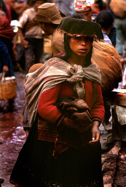 File:Young woman at Pisac Marketplace (472435599).jpg