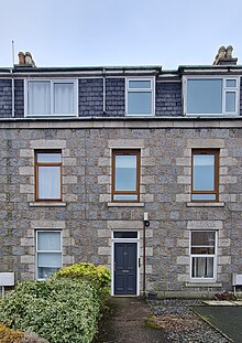 a picture of a mid-terrace, 3-floor granite Aberdeen tenement block,