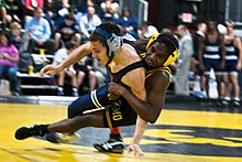 In this photo from the 2012 U.S. Military Duals tournament in Columbia, South Carolina, featuring wrestlers from Pennsylvania, South Carolina, Tennessee, and Virginia, the top wrestler is attempting to break his opponent down to the mat to both keep the bottom wrestler from scoring and to help in scoring points from the top position. 2012 U.S. Military Duals Tournament 120114-F-XH297-062.jpg