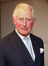 Charles III is the living embodiment of the Crown in each of his Commonwealth realms 2019 Reuniao Bilateral com o Principe Charles - 48948389972 (cropped).jpg