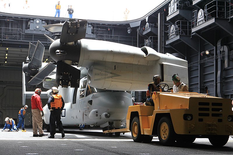 File:A U.S. Marine Corps MV-22B Osprey tiltrotor aircraft attached to Marine Medium Tiltrotor Squadron (VMM) 161 is lowered into the hull of the Japan Maritime Self-Defense Force helicopter destroyer JDS Hyuga (DDG 130614-M-BZ222-018.jpg
