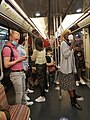 A women praying n a métro.jpg