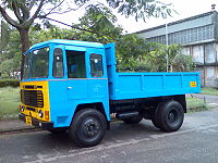 An Ashok Leyland Comet dump truck, an example of a very basic 4×2 dump truck used for payloads of 10 metric tons (11.0 short tons; 9.8 long tons) or less