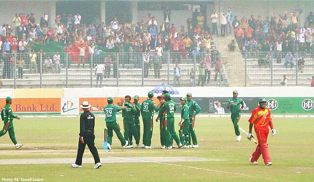 Bangladesh playing against Zimbabwe in 2009. Fans can be seen in the background waving a Bangladesh flag.