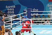 Deutsch: Boxen bei den Olympischen Jugendspielen 2018 Tag 12, 18. Oktober 2018 - Finale Fliegengewicht Mädchen – Martina La Piana (Italien, blau) schlägt Adijat Gbadamosi (Nigeria, rot) 5-0; Ringrichter ist James Beckles (Trinidad und Tobago). English: Boxing at the 2018 Summer Youth Olympics on 18 October 2018 – Girl's flyweight Gold Medal Bout - Martina La Piana (Italy, blue) beats Adijat Gbadamosi (Nigeria, red) 5-0; Referee is James Beckles (Trinidad and Tobago). Español: Boxeo en los Juegos Olímpicos Juveniles de Verano de 2018 en 18 de octubre de 2018 - Combate a medalla de oro de peso mosca para mujeres: Martina La Piana (Italia, azul) le gana a Adijat Gbadamosi (Nigeria, roja) 5-0; El árbitro es James Beckles (Trinidad y Tobago).