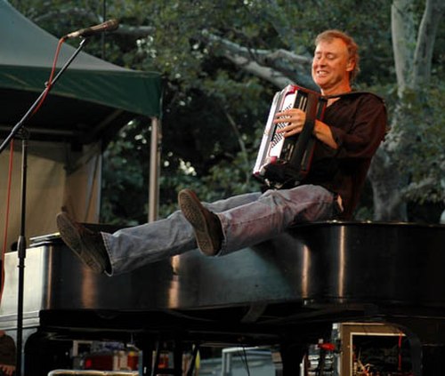 Hornsby playing accordion in Central Park in New York City