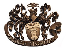 The coat of arms of the Singapore Municipal Commission in Victoria Theatre, with the motto "Majulah Singapura" Coat of arms of the Singapore Municipal Commission, Victoria Theatre, Singapore - 20141101.jpg