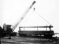 Crane loading lumber for US government, Puget Mill Co, Port Gamble, Washington, 1918 (INDOCC 486).jpg