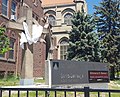 Cross and sign at Saint Dominic Catholic Church in Denver Colorado.jpg