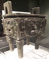 Da He ding (Chinese: 大禾方鼎; pinyin: Dà Hé fāngdǐng); Shang dynasty; Hunan Museum. This ritual bronze is one of the very rare vessels that is decorated with human faces