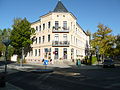 Double apartment building in a corner and open development