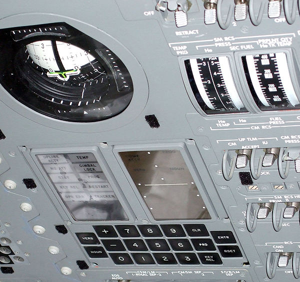 The display and keyboard (DSKY) interface of the Apollo Guidance Computer, mounted on the control panel of the Command Module, with the Flight Directo