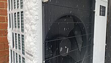 The outdoor unit of an air source heat pump operating in freezing conditions Ecodan outdoor unit in the snow.jpg