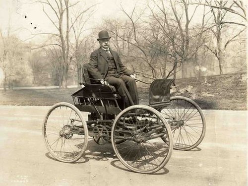 Elwood Haynes driving in his first automobile, the 1894 Pioneer, photo taken c. 1910